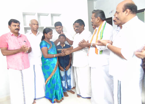 Sri. George M Thomas MLA hands over the key for house built for Edalampatt Pushpa by Karassery Bank,